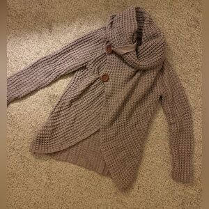 Cowl neck sweater with button detail.